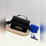 Coach выпустила новую модель сумки Georgie в стиле гармошки. Эта сумка действите