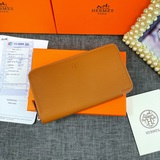 Оригинальный кожаный кошелек Hermès с текстурой личи, произведенный во Франции. 