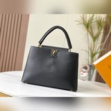 m48870 «Capucines Большая сумка» Эта модель выполнена из кожи Taurill, отличающе