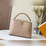 m48870 «Capucines Большая сумка» Эта модель выполнена из кожи Taurill, отличающе