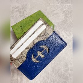 Новейшая модель Gucci — мужской кожаный кошелек с ажурными перепл