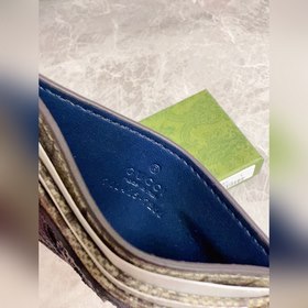 Новейшая модель Gucci — мужской кожаный кошелек с ажурными перепл