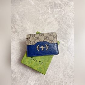 Новейшая модель Gucci — мужской кожаный кошелек с ажурными перепл