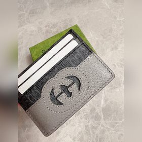 Новейшая модель Gucci — мужской кожаный кошелек с ажурными перепл
