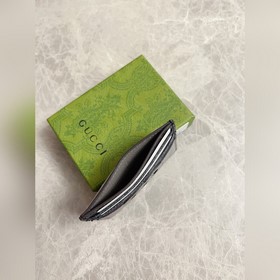 Новейшая модель Gucci — мужской кожаный кошелек с ажурными перепл