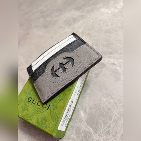 Новейшая модель Gucci — мужской кожаный кошелек с ажурными перепл