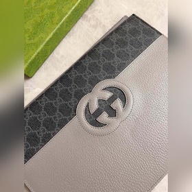 Новейшая мужская сумка Gucci украшена ажурными переплетенными дво
