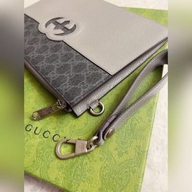 Новейшая мужская сумка Gucci украшена ажурными переплетенными дво