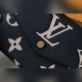 Этот кошелек на молниизготовлен из двухцветной кожи Monogram Empr