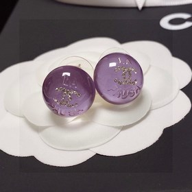 Сережки-гвоздики с фиолетовым кристаллом от Chanel. Новая модель