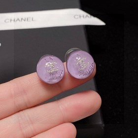 Сережки-гвоздики с фиолетовым кристаллом от Chanel. Новая модель 