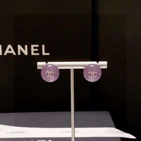Сережки-гвоздики с фиолетовым кристаллом от Chanel. Новая модель 