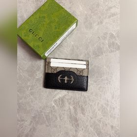 Новейшая модель Gucci — мужской кожаный кошелек с ажурными двойны