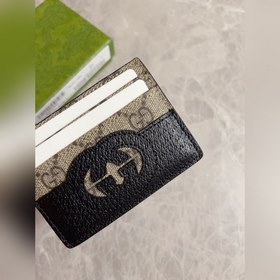 Новейшая модель Gucci — мужской кожаный кошелек с ажурными двойны