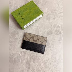 Новейшая модель Gucci — мужской кожаный кошелек с ажурными двойны