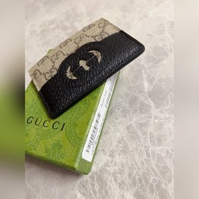 Новейшая модель Gucci — мужской кожаный кошелек с ажурными двойны