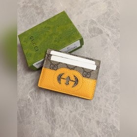 Новейшая модель Gucci — мужской кожаный кошелек с ажурными двойны