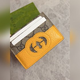 Новейшая модель Gucci — мужской кожаный кошелек с ажурными двойны