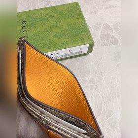 Новейшая модель Gucci — мужской кожаный кошелек с ажурными двойны