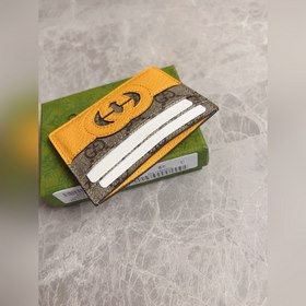 Новейшая модель Gucci — мужской кожаный кошелек с ажурными двойны