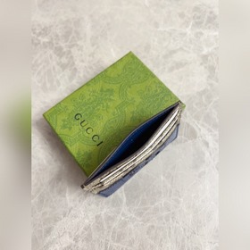 Новейшая модель Gucci — мужской кожаный кошелек с ажурными двойны