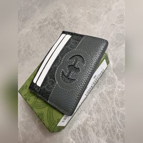 Новейшая модель Gucci — мужской кожаный кошелек с ажурными двойны