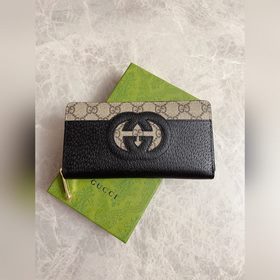 Новейшая модель Gucci — мужской кошелек на молнии с ажурными двой