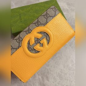 Новейшая модель Gucci — мужской кошелек на молнии с ажурными двой