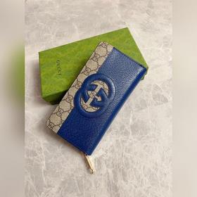 Новейшая модель Gucci — мужской кошелек на молнии с ажурными двой