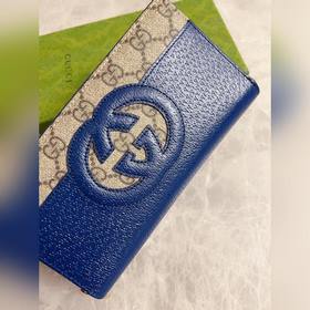 Новейшая модель Gucci — мужской кошелек на молнии с ажурными двой