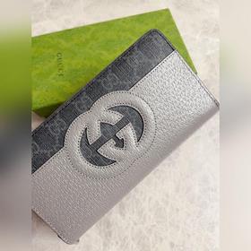 Новейшая модель Gucci — мужской кошелек на молнии с ажурными двой