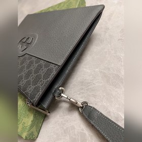 Новейшая мужская сумка Gucci украшена ажурными переплетенными дво