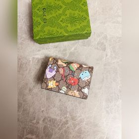 Новинка от Gucci! Карман для карт с камуфляжным рисунком и кожа и