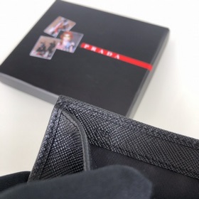 Дамский кожаный кошелек Prada, модель 1M0204, кожа с крестообразн