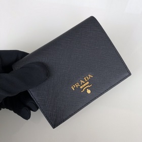 Дамский кожаный кошелек Prada, модель 1M0204, кожа с крестообразн