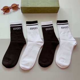 Одна коробка содержит 4 пары. Новые длинные носки Gucci, изготовл