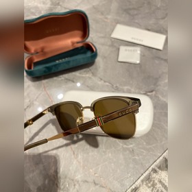 Новинка на официальном сайте Солнцезащитные очки Gucci для мужчи