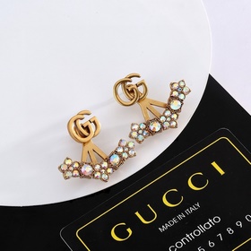 Серьги Gucci с двойным логотипом G. Логотип виде первых букв брен