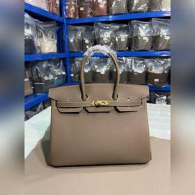 Фотографииз мастерской Birkin Platinum, слоновая кость с золотой