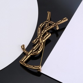 Брошь Yves Saint Laurent из оригинальной латуни. Компания Yves Sa