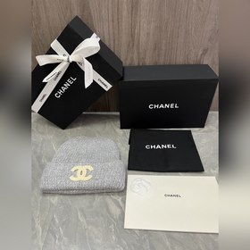 Шерстяная вязаная шапка Chanel. Ткань