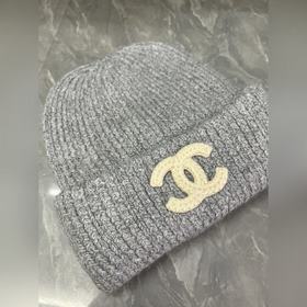 Шерстяная вязаная шапка Chanel. Ткань 