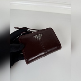 Короткий кошелек PRADA из коричневой в