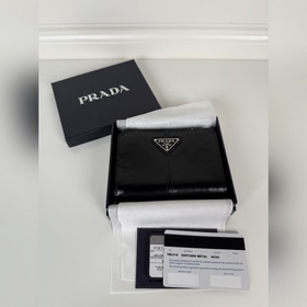 Черный кожаный кошелек Prada из промас