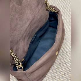 Коричневая сумка YSL Calypso отличаетс