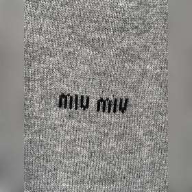 Трикотажный свитер MiuMiu с V-образным