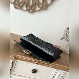 Подержанная чёрная сумочка Chanel с уз