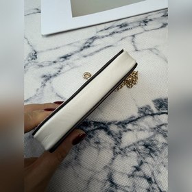 Этот белый кожаный кошелек COACH с при