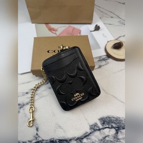 Черный кошелек Coach с металлической ц