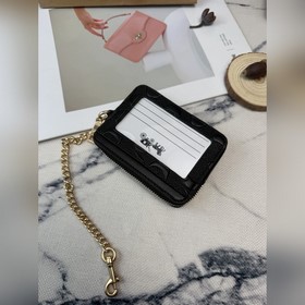 Черный кошелек Coach с металлической ц